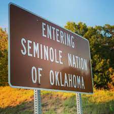 Picture of road sign that says: ENTERING SEMINOLE NATION OF OKLAHOMA.